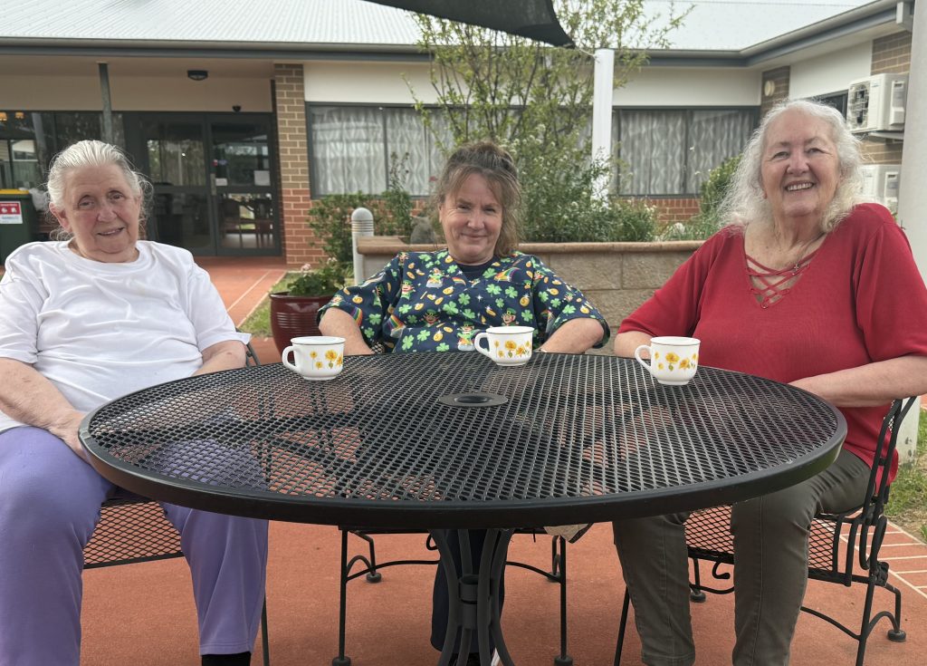 Staff profile Merryl with residents 2 2